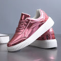 Unisex rose gold sequin platform sneakers with thick sole and round toe.