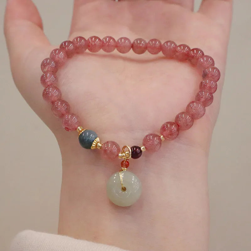 Geometric Strawberry Quartz women's bracelet with a lucky Bagg charm and a silver safety buckle clasp.