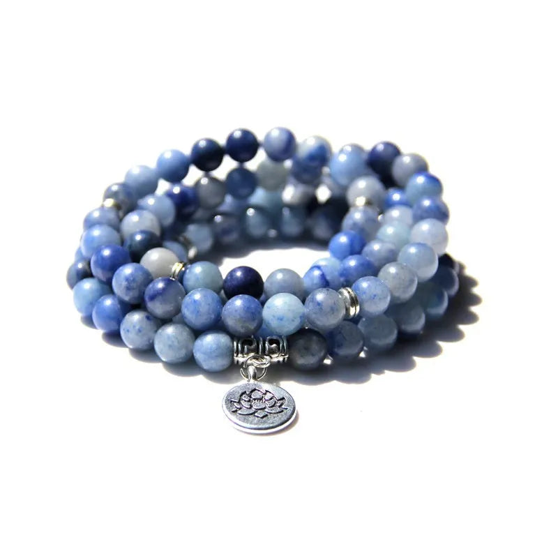 Vintage natural stone bracelet for women with a geometric lotus pendant on a model's wrist.