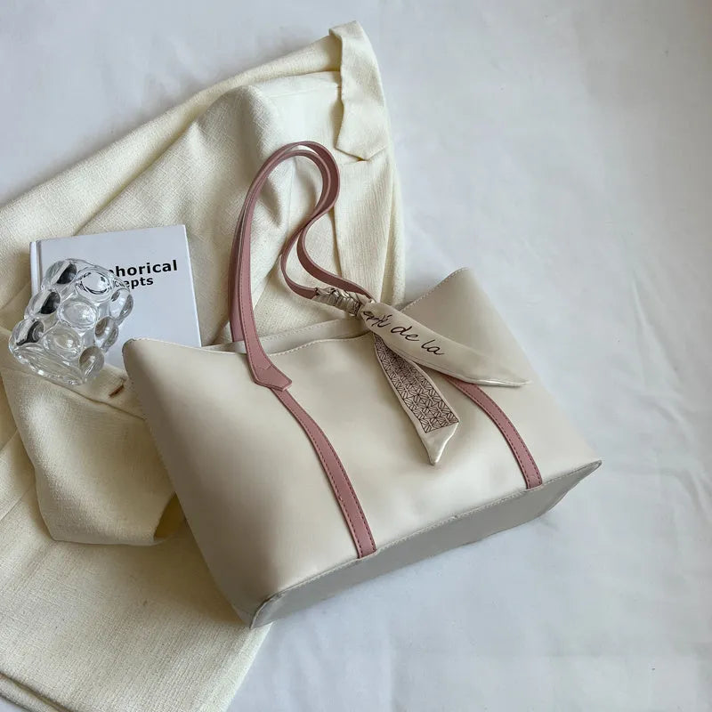 Women's soft large tote bag in a chosen colour, showing outer pockets and sewing detail.