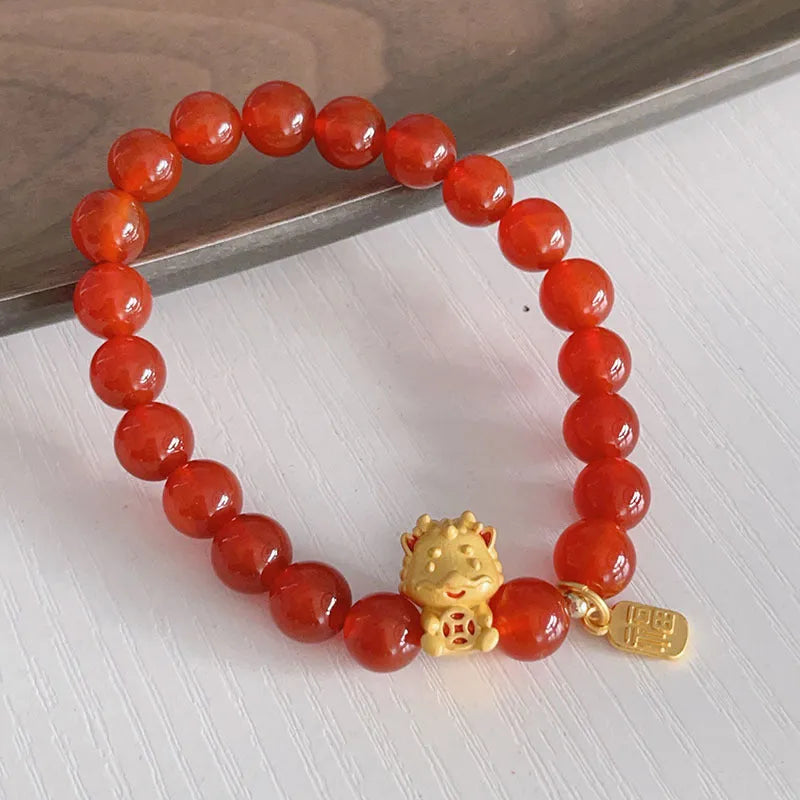 Handmade red agate bracelet with dragon and lucky bag Chinese designs for women.