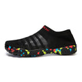Men's lace-up flyknit water shoes in camouflage colour on a sandy beach