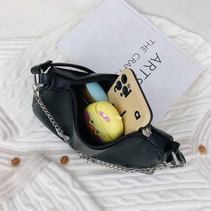 Square black PU leather crossbody bag with a butterfly chain strap and external structured pocket.