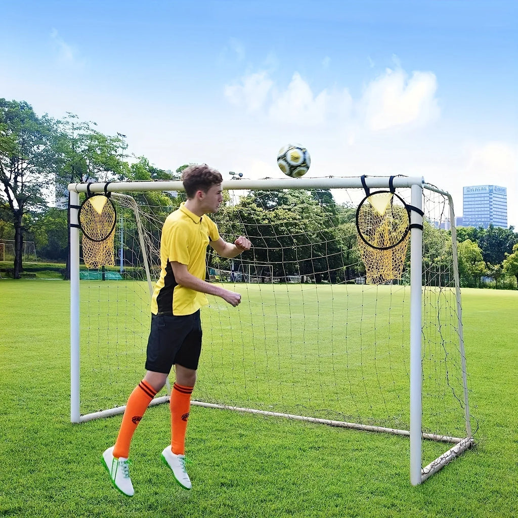 Black portable soccer training goal net set up on grass, showing 130cm square frame and netting.