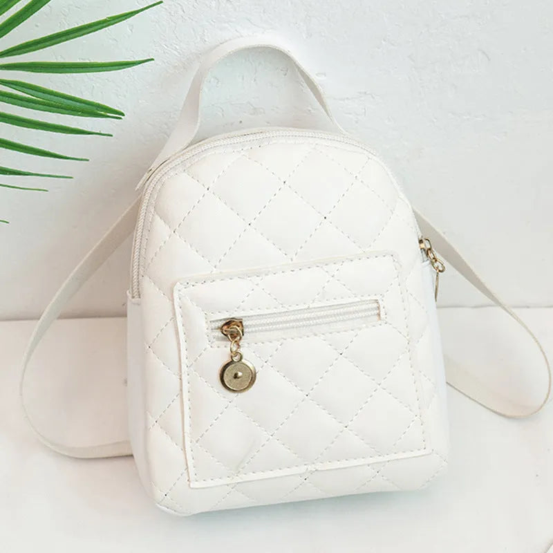 Girls' hard case Korean-style embroidered backpack in pink showing vertical square shape and soft carry handle.