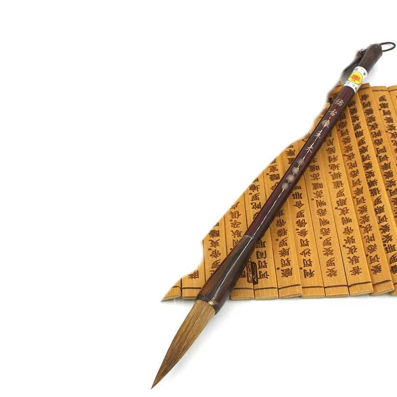 Traditional Chinese wolf hair calligraphy brush with steel rod, shown in large, medium, and small sizes.
