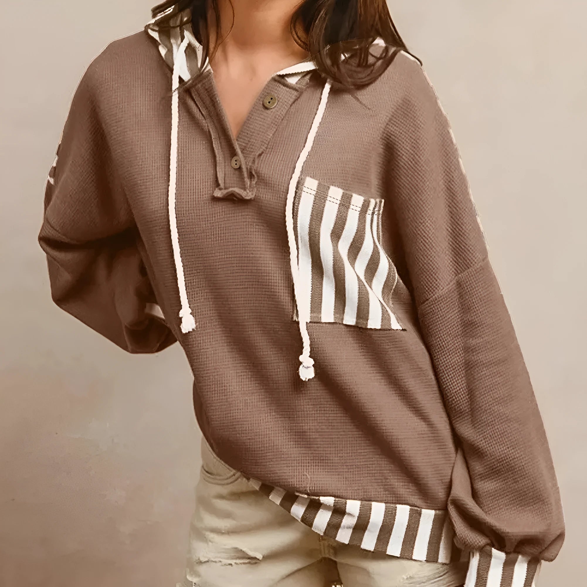 Straw yellow waffle texture striped patchwork hoodie with button neck and drawstring hood.