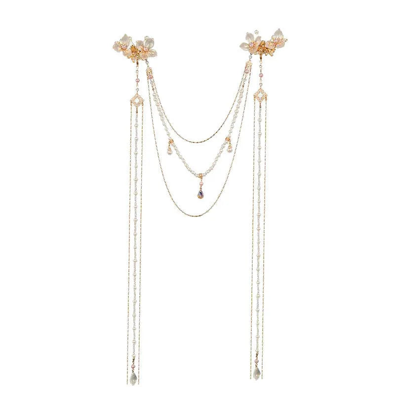 Gold women's hairpin with pearl, diamond acrylic details and a long tassel.