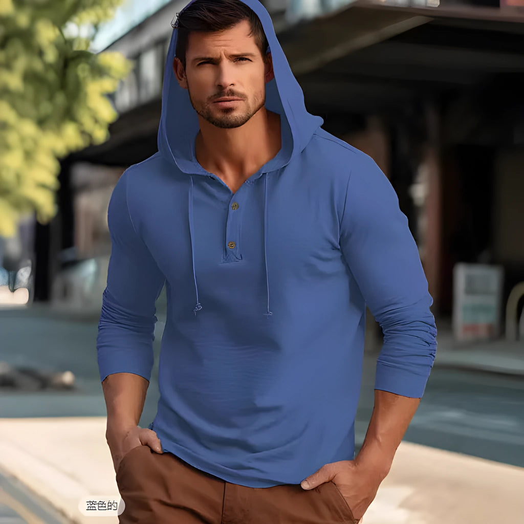 A cotton pullover hoodie for youth in dark blue, shown in a casual setting.