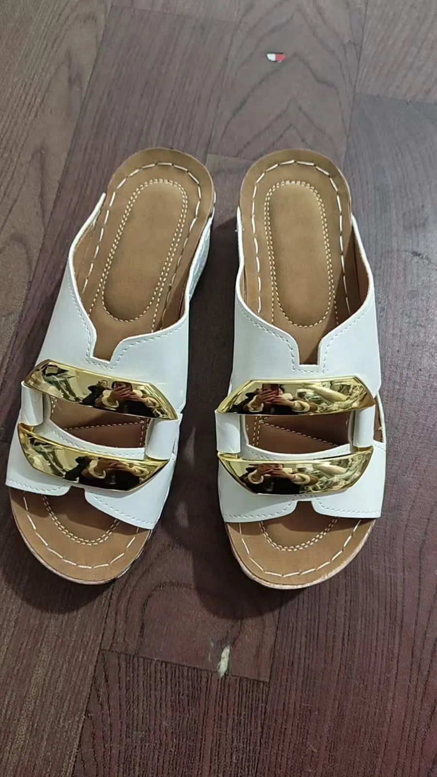 Roman style platform sandals in white, black, khaki, and sea blue on a solid background
