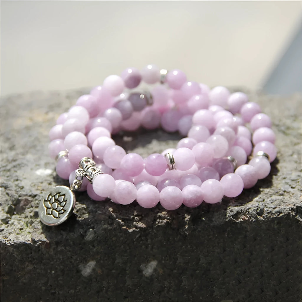 Vintage natural stone bracelet for women with a geometric lotus pendant on a model's wrist.