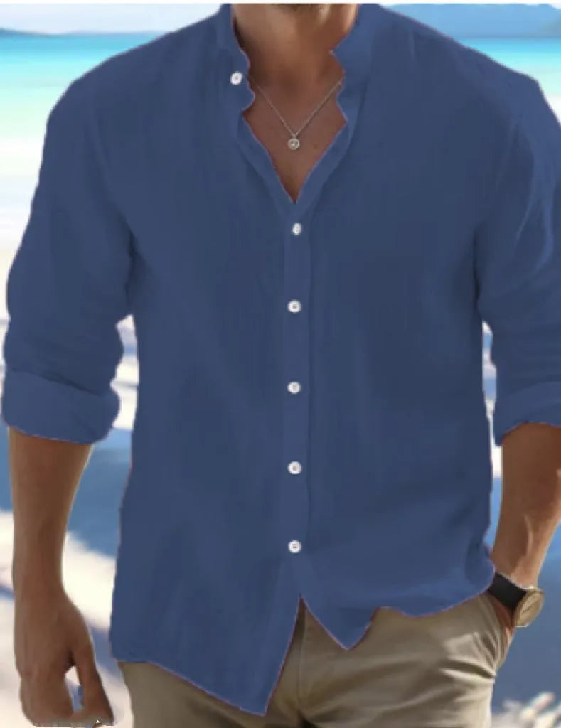 Men's long-staple cotton pullover shirt in light blue with collage stitching detail, laid flat.