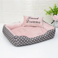 Polka dot printed square nest dog bed with removable embroidery pillow in grey, blue, pink, or red.