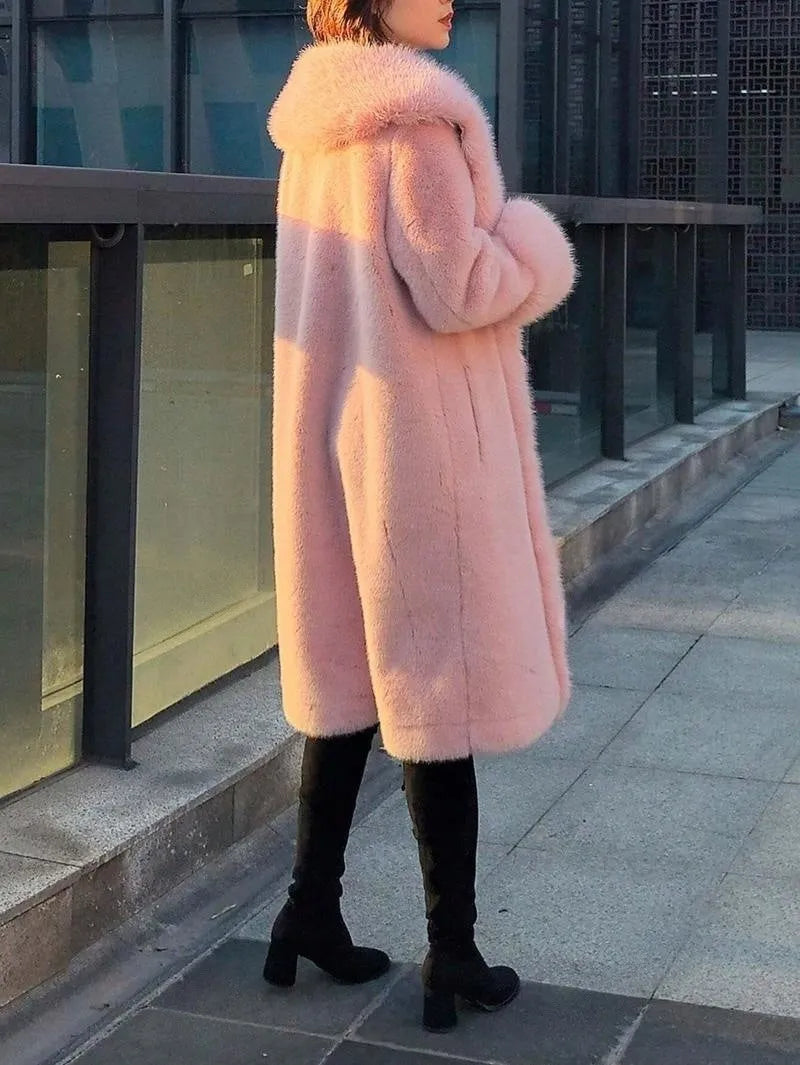 Grey women's leather coat with a faux fur collar and visible plush lining, shown in a mid-length style.