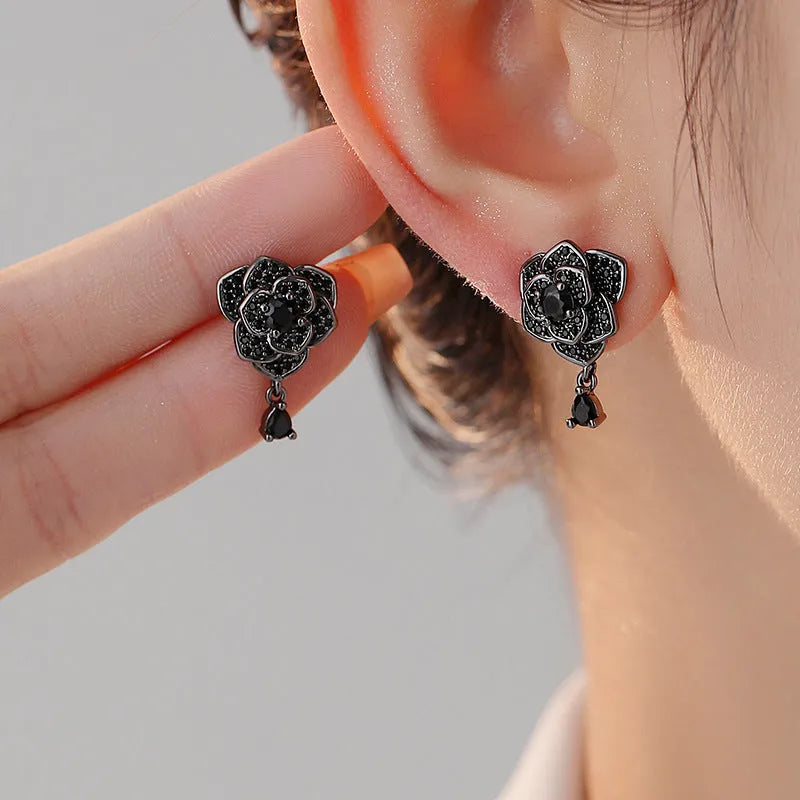 Women's rose gold plated flower ear studs with black zircon stones