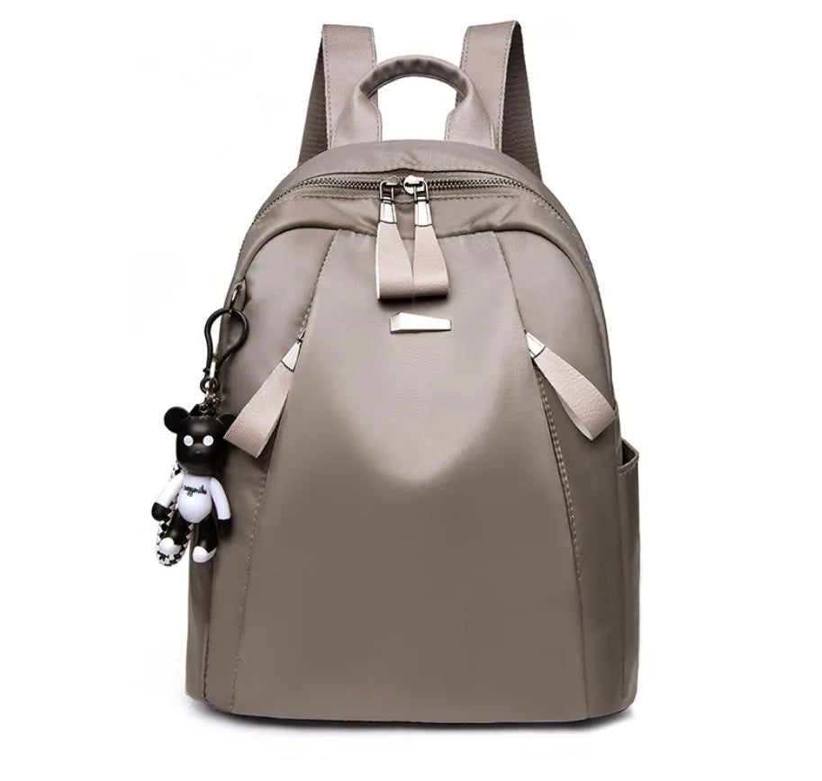 Medium wild fashion rucksack in Oxford cloth with vertical square shape, double straps, and zipper closure available in black, gray and wine red