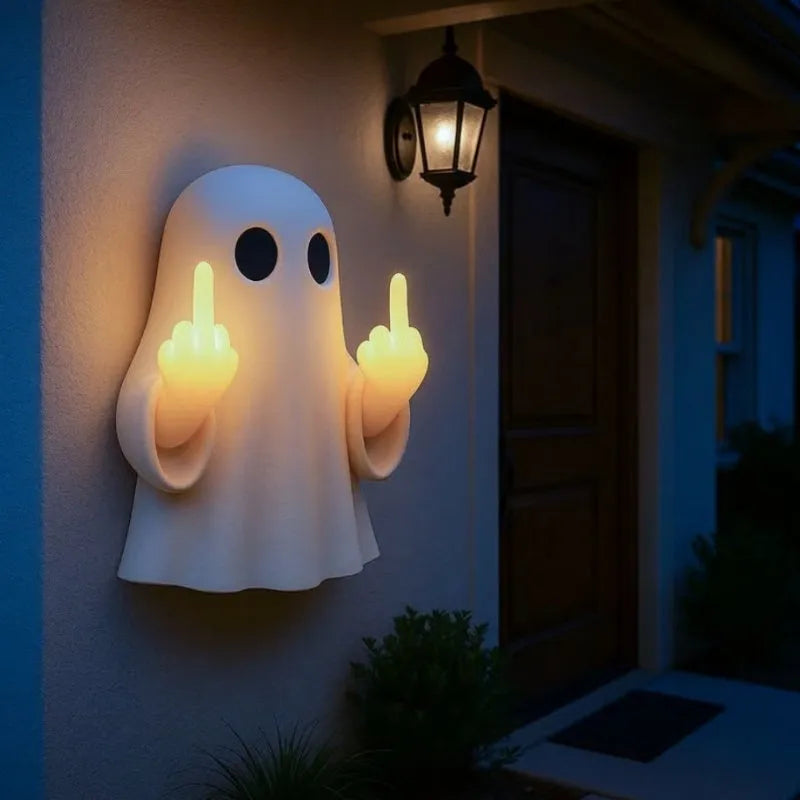 Small white modern ghost statue night light for Halloween decoration on a table.