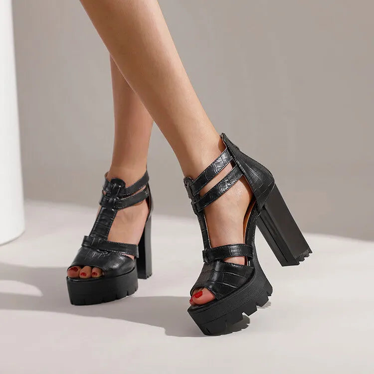 Women's black platform high heel sandals with a round toe and back zipper.