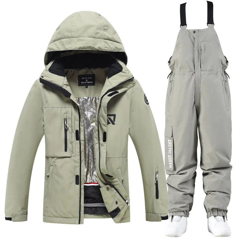 Men's and women's waterproof winter ski suit in blue top with grey blue trousers.
