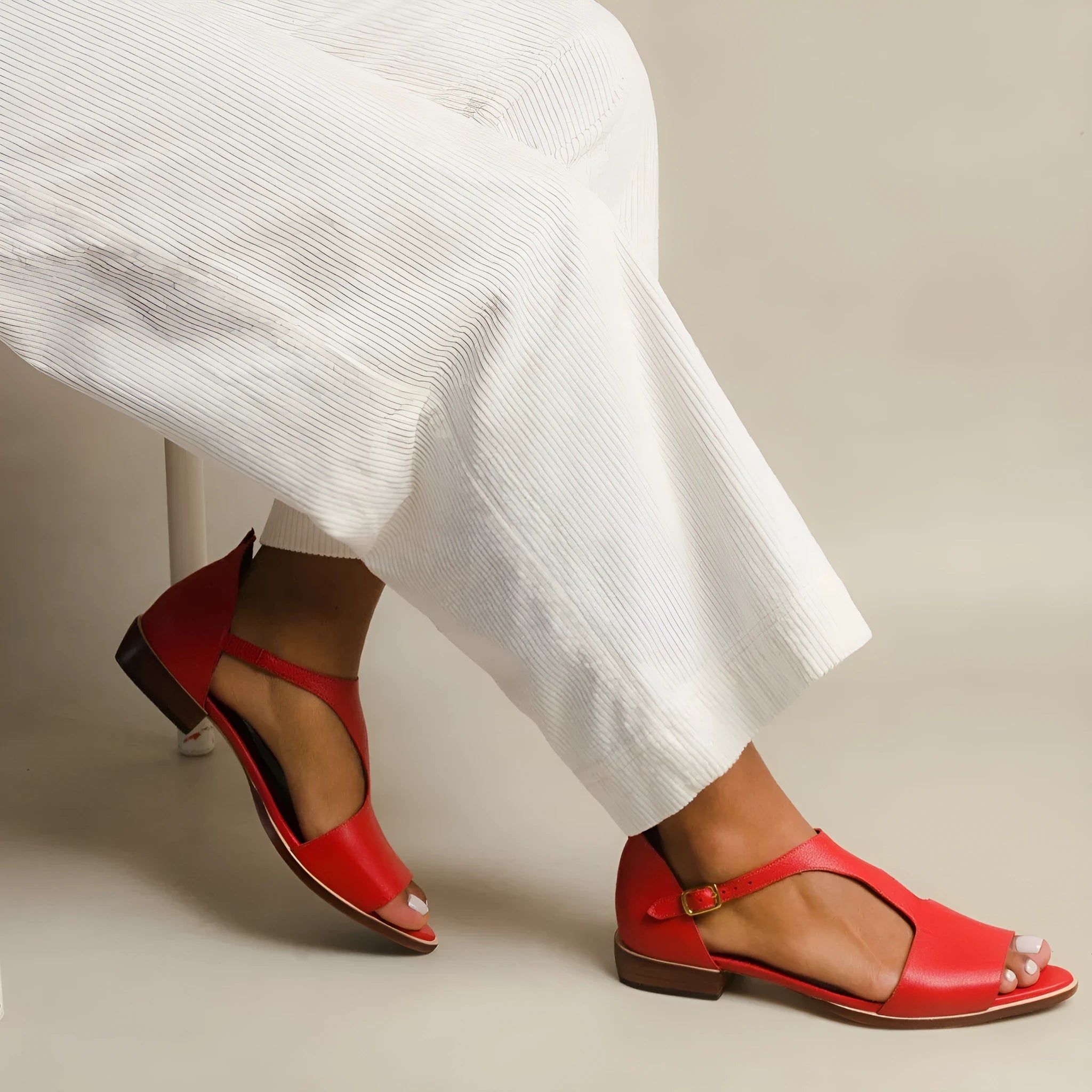 Red women's casual sandals with a square buckle and herringbone toe detail on a low-top PU upper.
