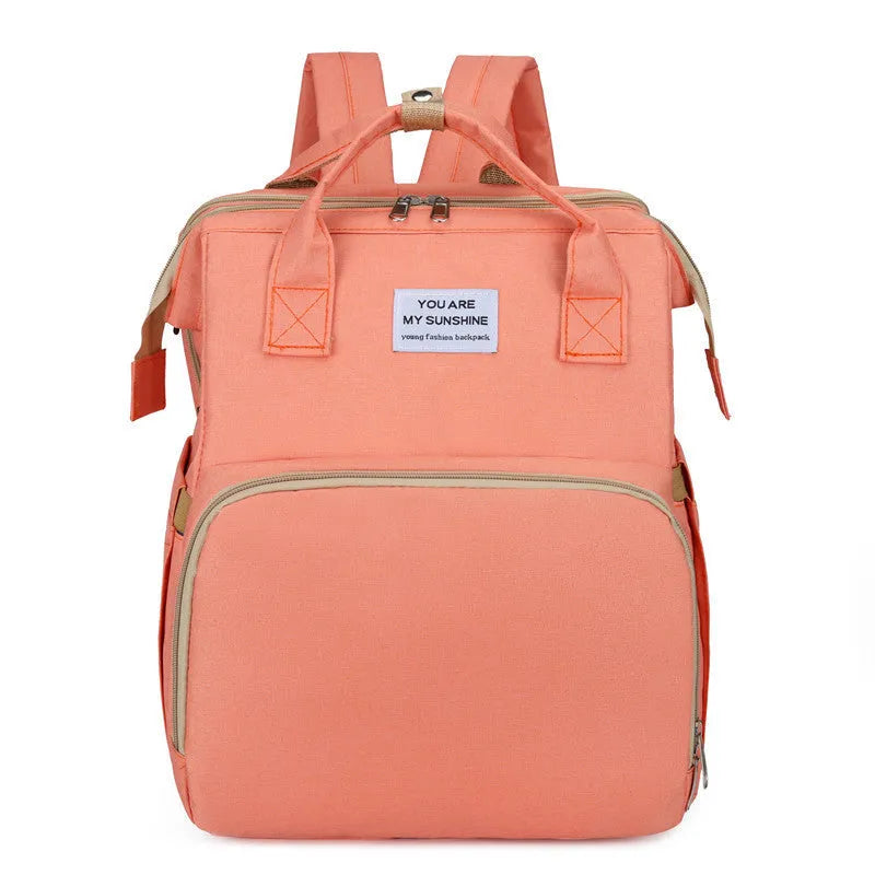 Portable folding mummy bag in multiple colours with curved shoulder strap and USB interface