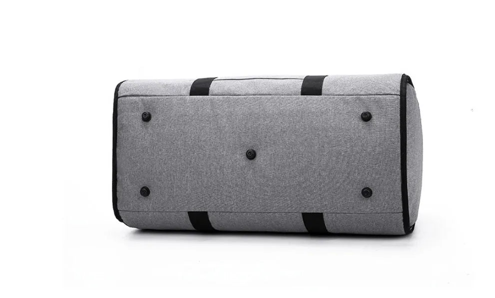 Cylinder-shaped travel bag in red colour with zipper closure and carrying handles