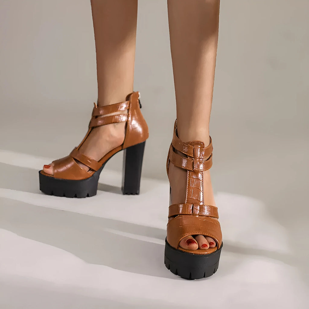 Women's black platform high heel sandals with a round toe and back zipper.