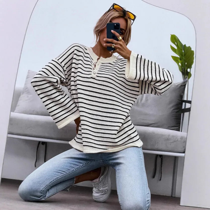 Black striped women's casual long sleeve top with drop shoulders and button details