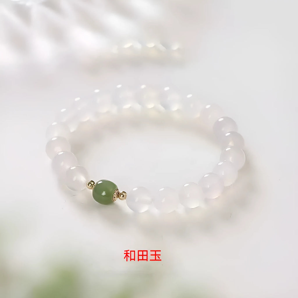 Handmade white agate bracelet with Hetian Jade and Cinnabar inlays showing 6mm and 8mm bead options