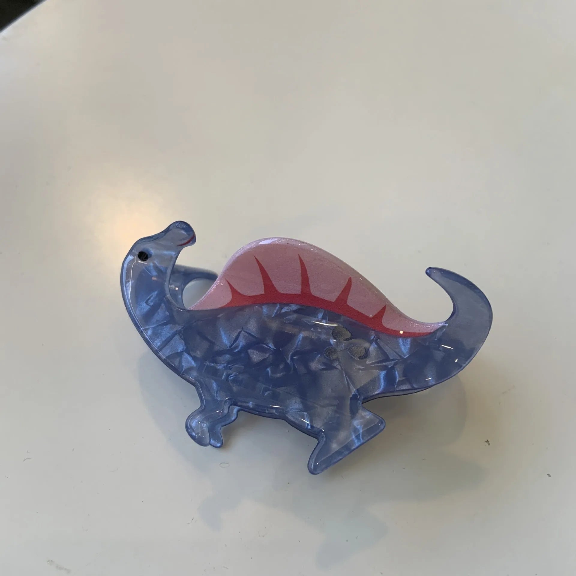 Acrylic dinosaur jaw clip hairpin in blue, brown, green, pink and purple colours with manual grip style