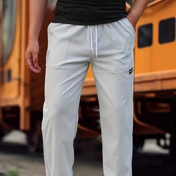 Men's casual polyester trousers for spring and autumn in light grey colour.