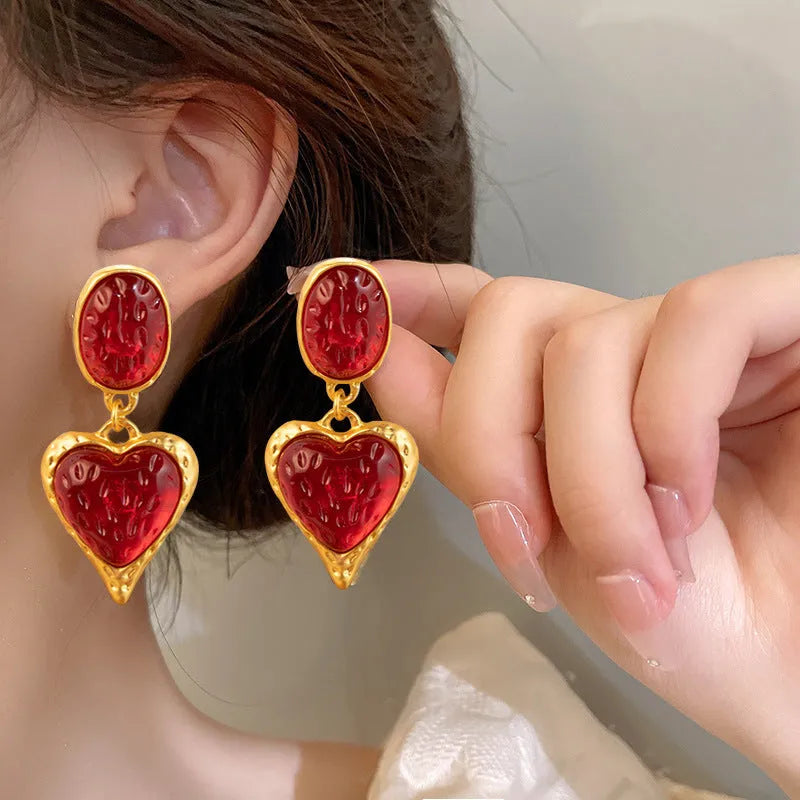 Pleated oval heart stud earrings in alloy showing four colour options