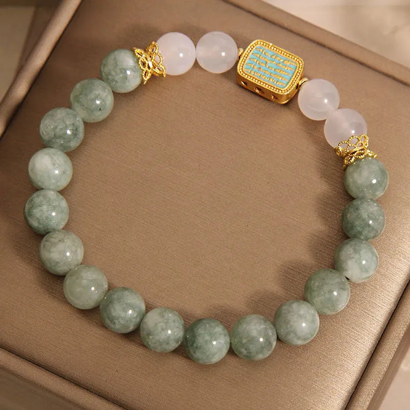 Women's oil green emerald crystal bracelet with five scriptures design on white background