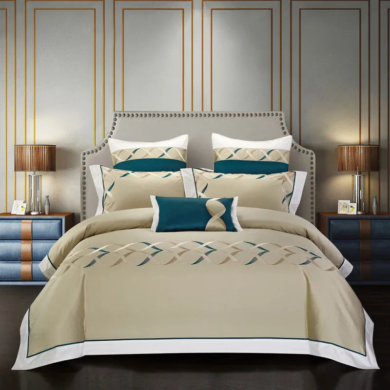 A four-piece cotton bedding set with embroidery, shown in one of five available designs.