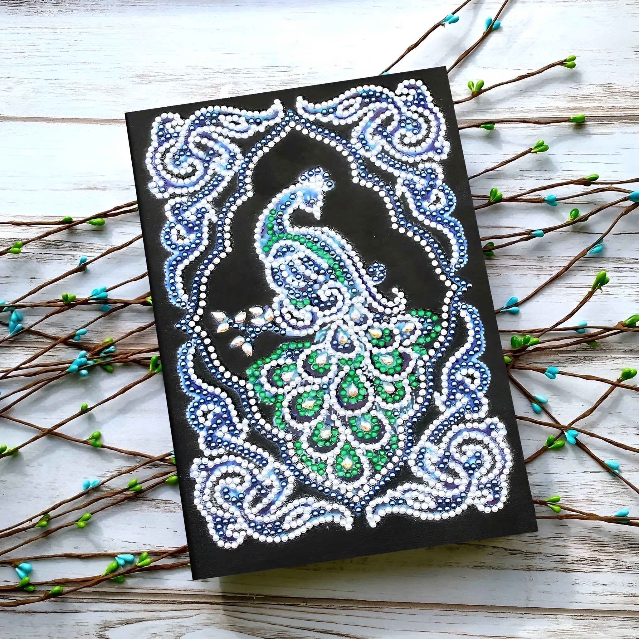 Black A5 diamond painting notebook with peacock design featuring shaped and bright drill rhinestones
