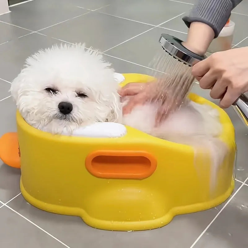 Blue PVC duck-shaped bathtub for washing dogs and cats on a bathroom floor.