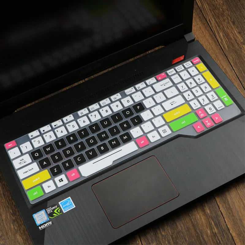 Clear protective keyboard film cover for ASUS Flight 14-inch laptop on a keyboard.