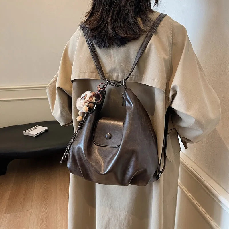 Women's PU leather shoulder bag in horizontal square shape with single strap, showing interior mobile phone compartment