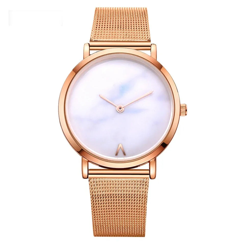 Vansvar women's quartz watch with silver mesh band and marble dial