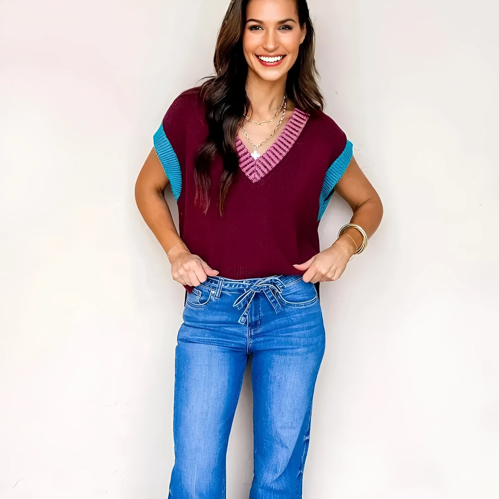 Burgundy women's loose sweater with V-neck, contrast trim, and cuffed short sleeves