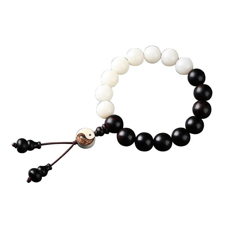 Handcrafted Bodhi seed bracelet with white Corypha Umbraculifera and Blackwood beads in eight-diagram pattern