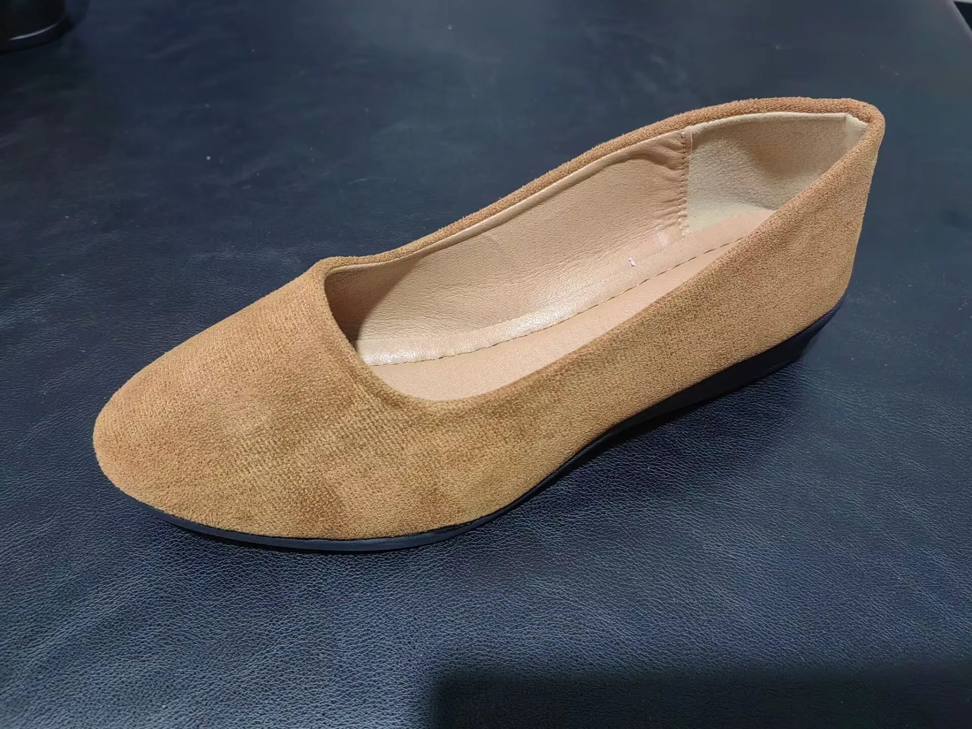 Women's plus size low wedge pumps in Gommino style with pointed toe and suede upper.