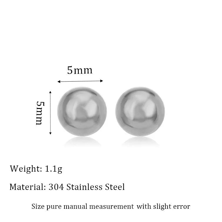 Stainless steel ball stud earrings in gold and silver finishes on a grey background.