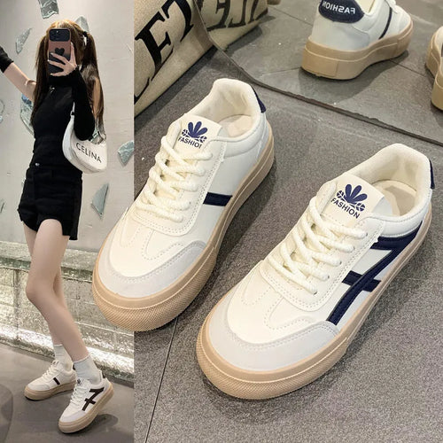 Low top blue board shoes with round toe and flat rubber sole on white background