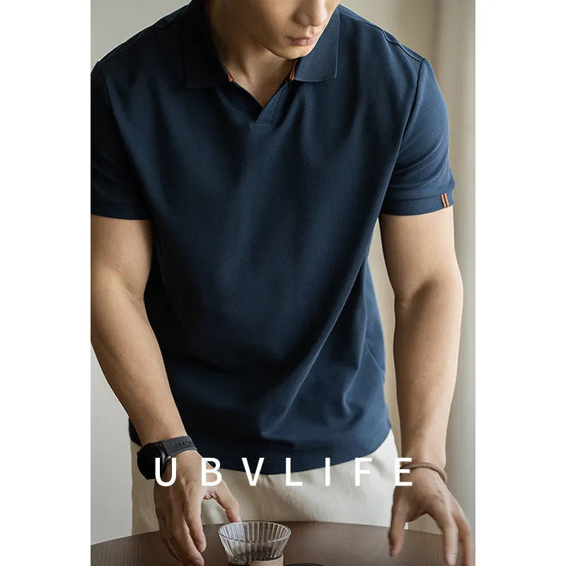 American-style short-sleeve polo shirt in blue, shown on a model.