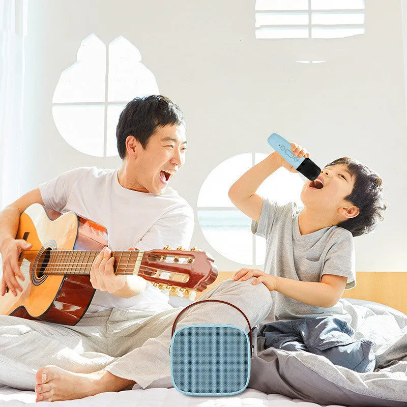Compact white wireless Bluetooth speaker with microphone, showing USB port.