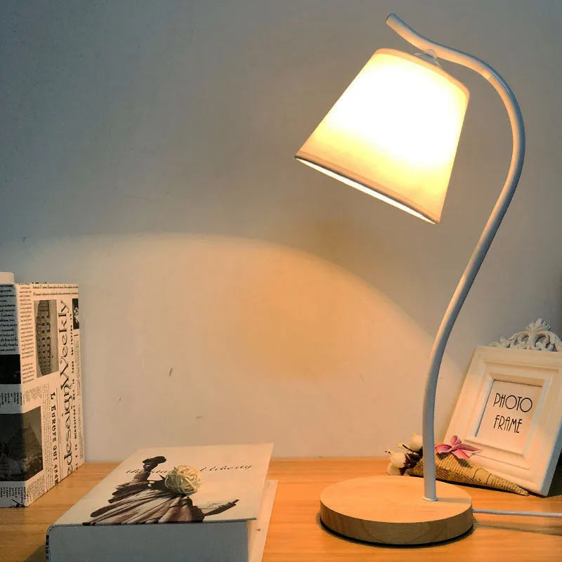 Nordic style desk lamp with dimmer switch in white finish on wooden desk
