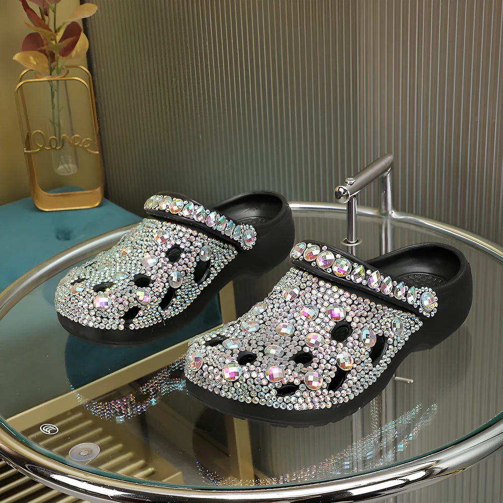 Black women's platform sandals with rhinestone decoration and hole shoes design on an EVA sole.