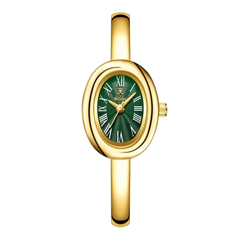 Women's slim oval retro quartz watch in gold colour on wrist
