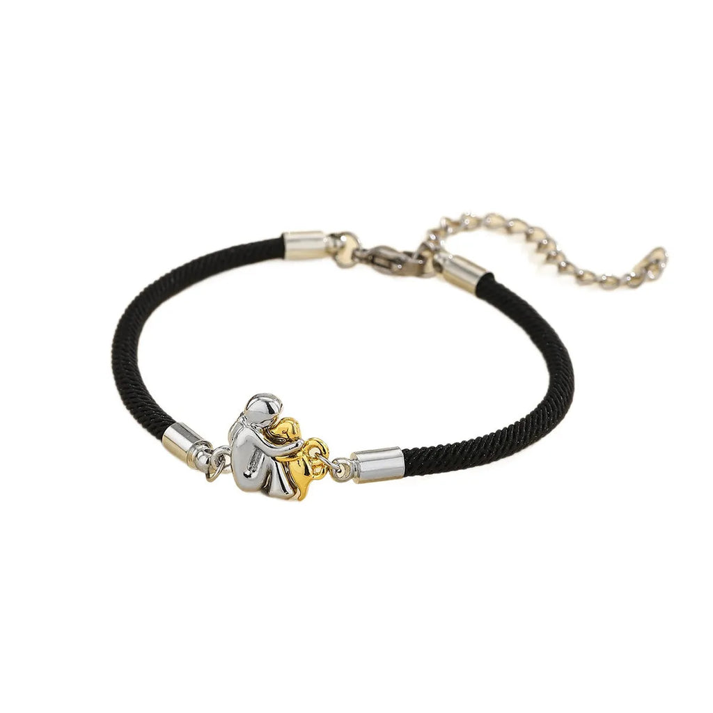 Woven angel motif couple bracelet in black with electroplated flexible wire finish